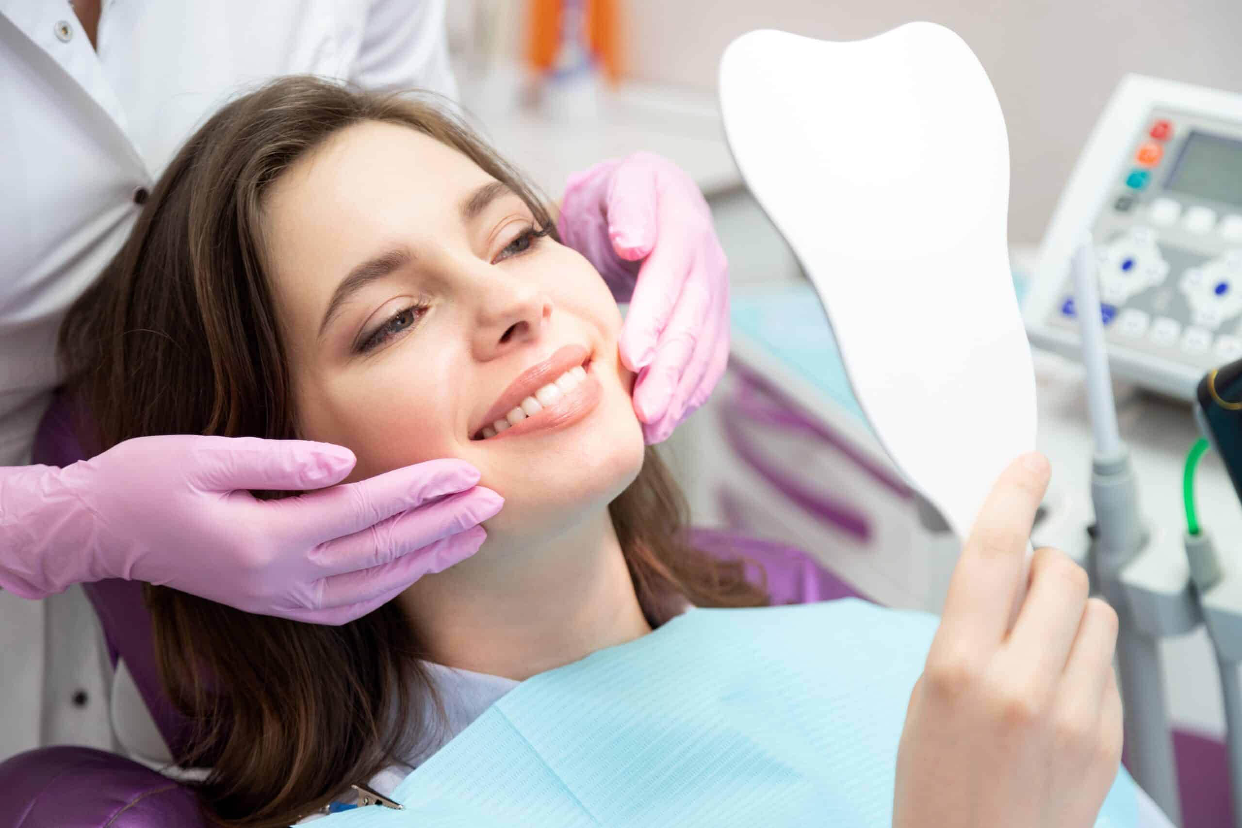 Patient viewing her smile during a cosmetic dentistry consultation